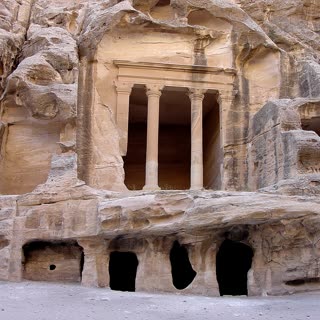 A columned rock-cut chamber in Siq al-Barid at Little Petra, where the back trail begins